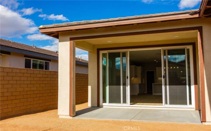 Backyard with covered patio.