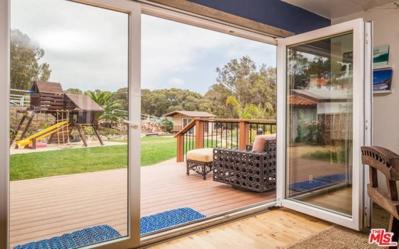 Looking out from family room to play yard