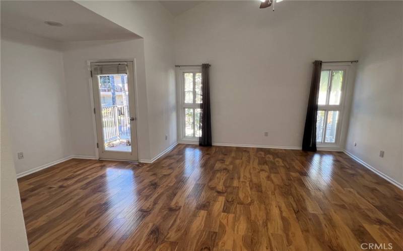 Master bedroom with sitting area and balcony