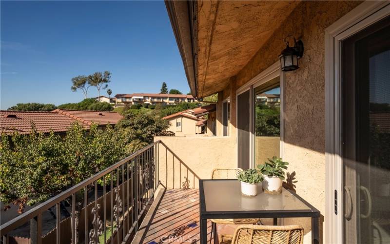 Upstairs balcony joins family room and dining room