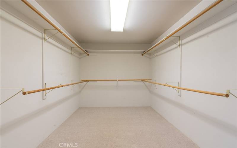 walk in closet in primary bedroom