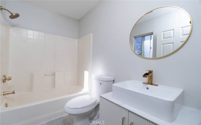 Primary ensuite bathroom, new vanity and brushed gold fixtures