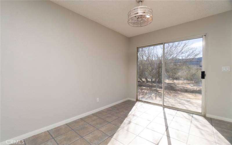 Dining area with sliding glass door to the yard