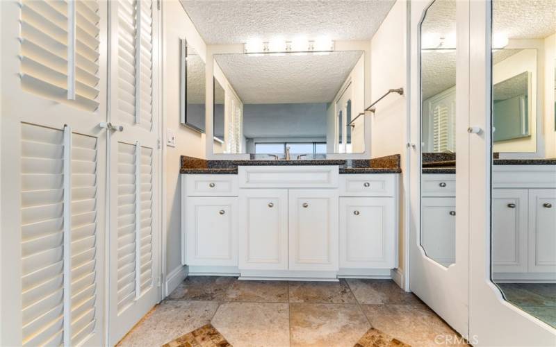 Upgraded vanity and mirrored doors to walk in closet