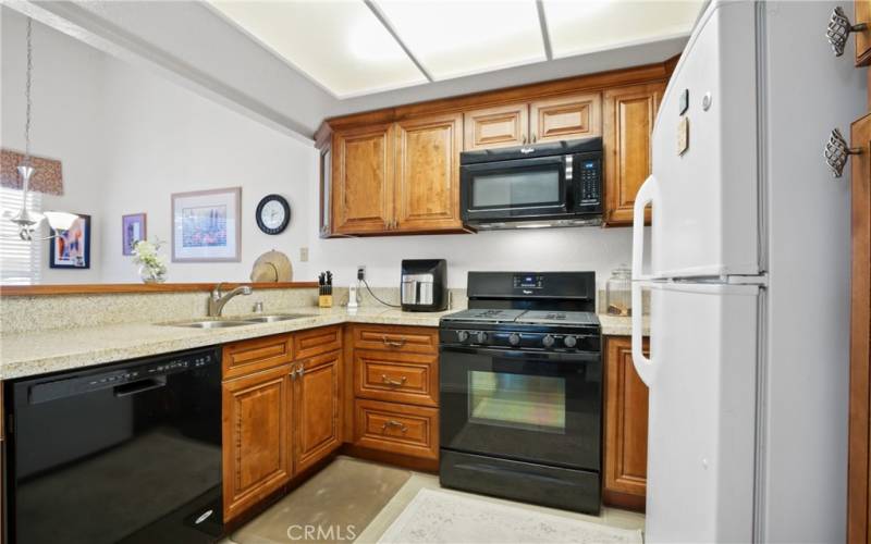 Upgraded cabinets, granite counters, tile flooring.