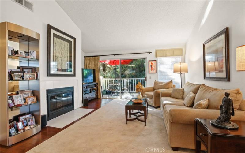 Laminate flooring, vaulted ceiling and fireplace