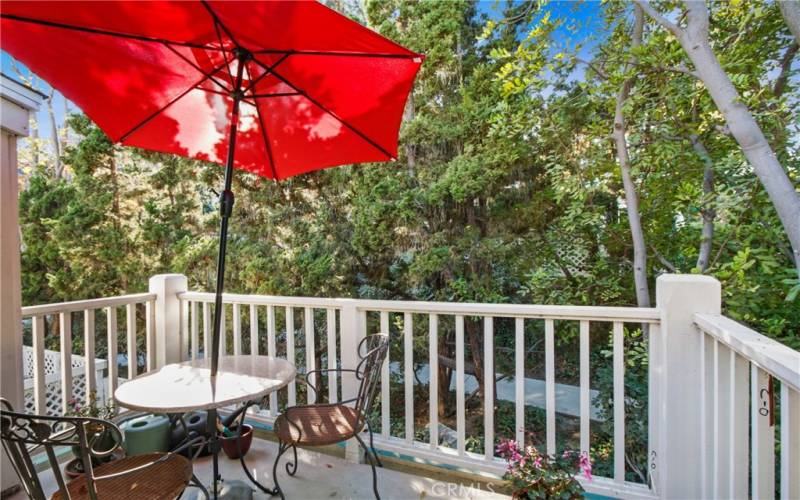 Balcony deck over looking lush green landscaping