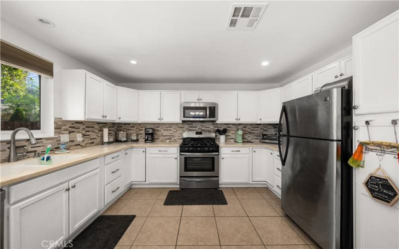 Gas stove and 5 burners.  Plenty of counter space and cabinetry.