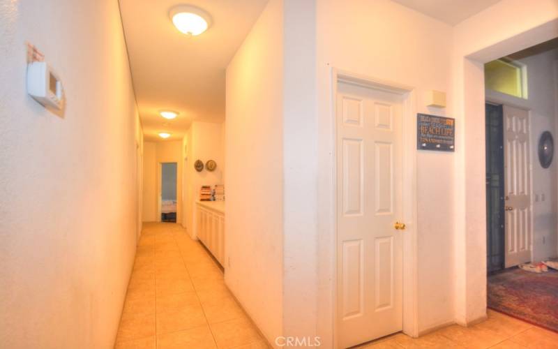 Hallway with view of Main Entry, Half Bath, towards 3 bedrooms, Laundry Room, Bathroom