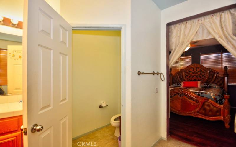 Master Bath view of Private Toilet and Baster Bedroom