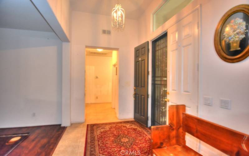 Entry Way showing Double Door Entry with Steel Security Doors and Hallway to Master Bedroom, Bedrooms, Bathroom, and Laundry Room.