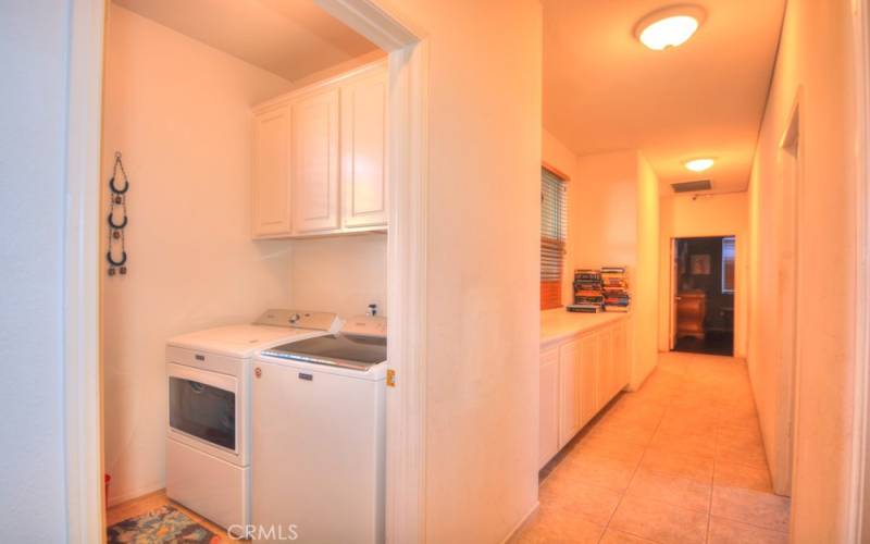 Laundry Room. Storage / Linen Cabinets, Bathroom Entry on right