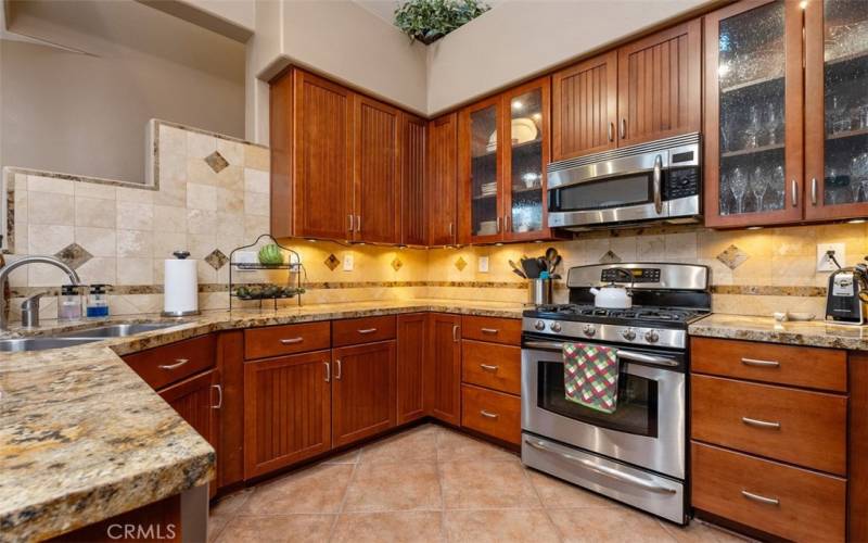 Beautiful cabinetry with glass cupboards & stainless steel appliances