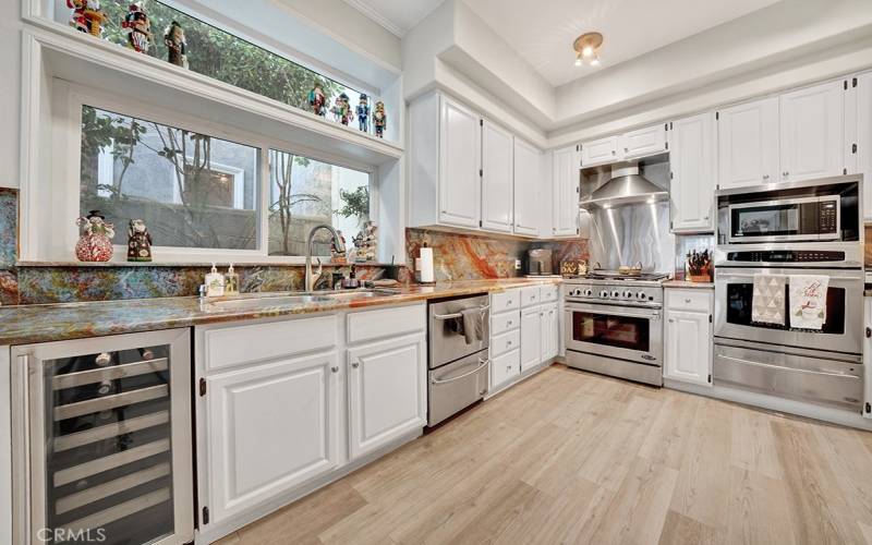 Kitchen with updated stainless appliances.