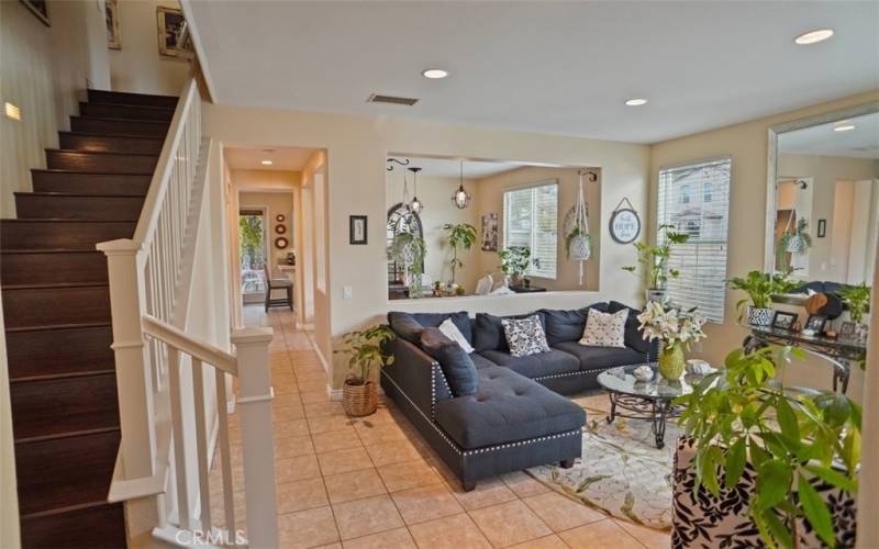 Living room with adjacent  formal dining area