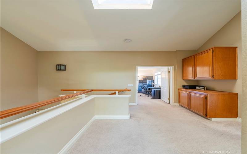 Upstairs hall with skylight for bright open feel