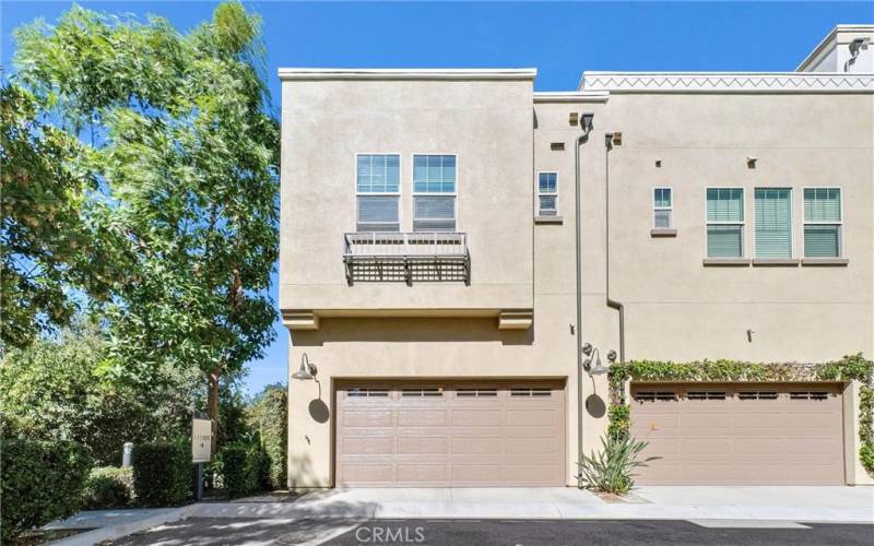 Rear view of property with garage door.