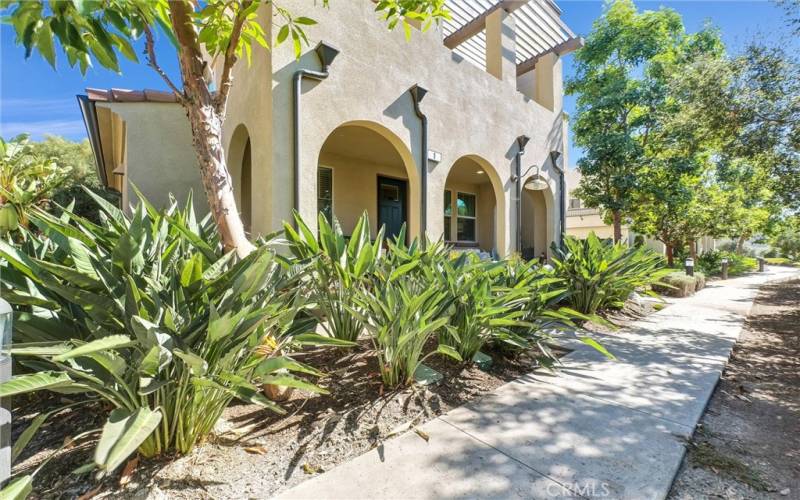 Pathway to the property and angled view of the front.