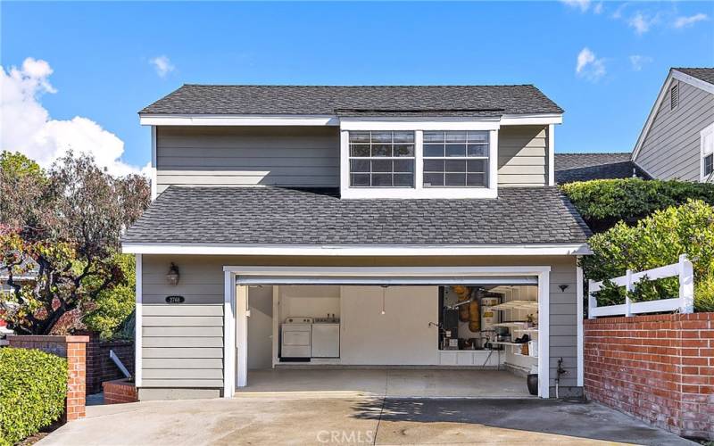 A closer view of the garage and the front of the home.