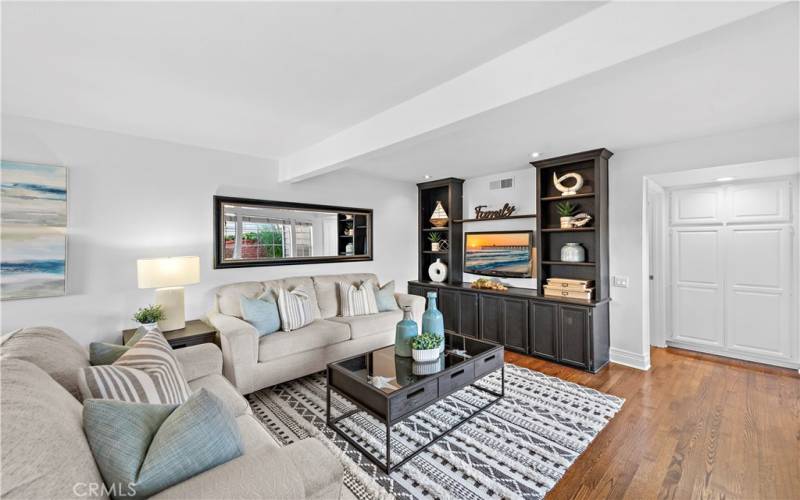 The dark cabinets are built-ins at the end of the family room.