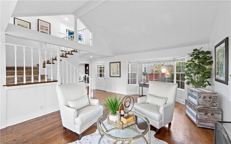 A view of the living room which also has a fireplace that is just out of view.