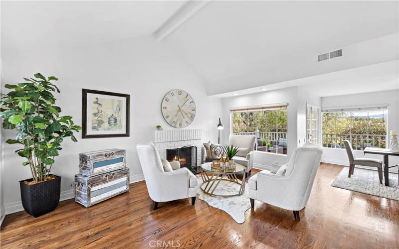 Beautiful wood floors, tall ceilings and lots of windows create a great sunny room.