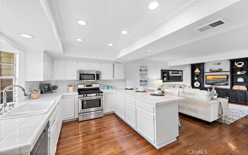 Freshly painted white walls and great recessed lights gives lots of light, with good space to cook.