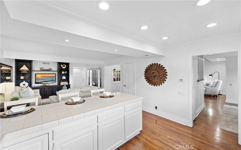 Looking out from the kitchen to the family room and the formal dining room.