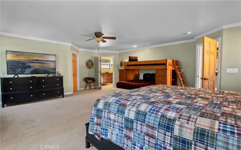 Expansive Master Suite with Balcony, Walk-In Closet, En Suite Bath, and Hidden Murphy Bed for Versatility.