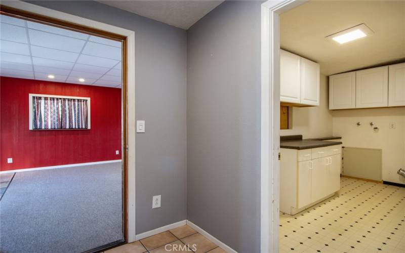 Large laundry room with additional storage.