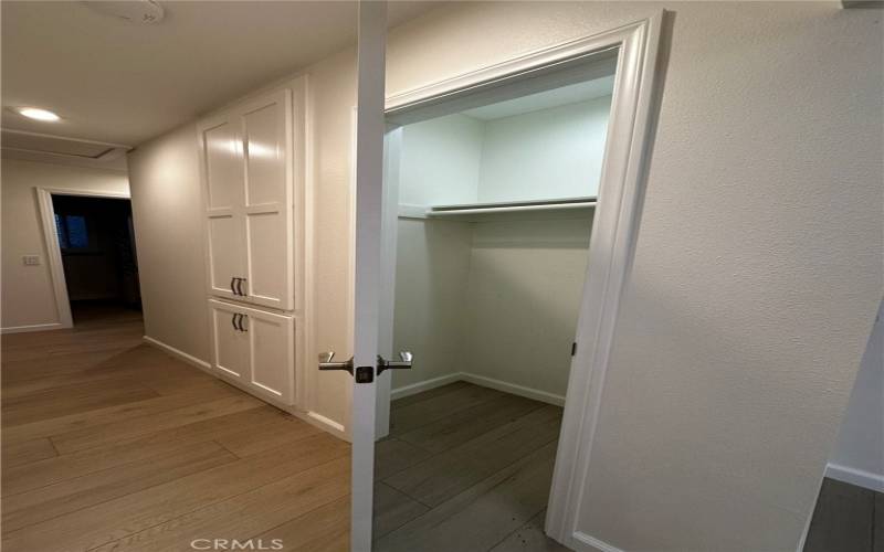 Hallway with coat closet and storage
