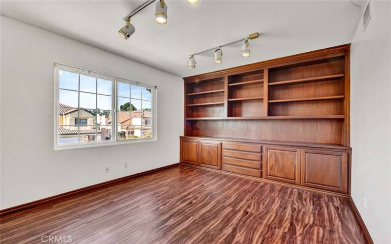 One of 3 upstairs bedrooms. Could also be a study or office.