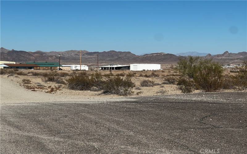 Structures by the entrance of the dirt road that leads to the property