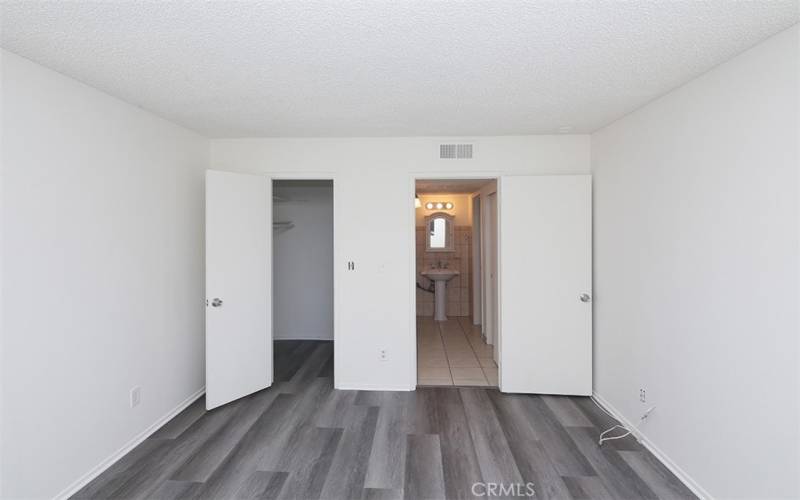 Bedroom with new floor, paint & walk in closet.