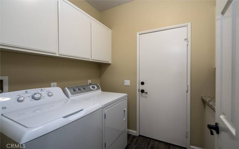 Laundry with storage and granite counter