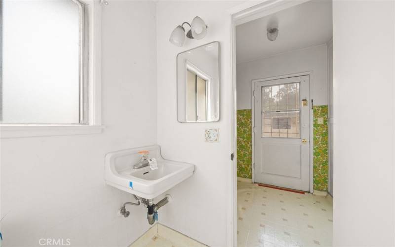 Bathroom with shower off the laundry room