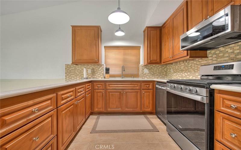 Tile floor and Maple cabinets