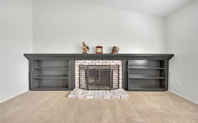 Vaulted ceilings and a living room fireplace