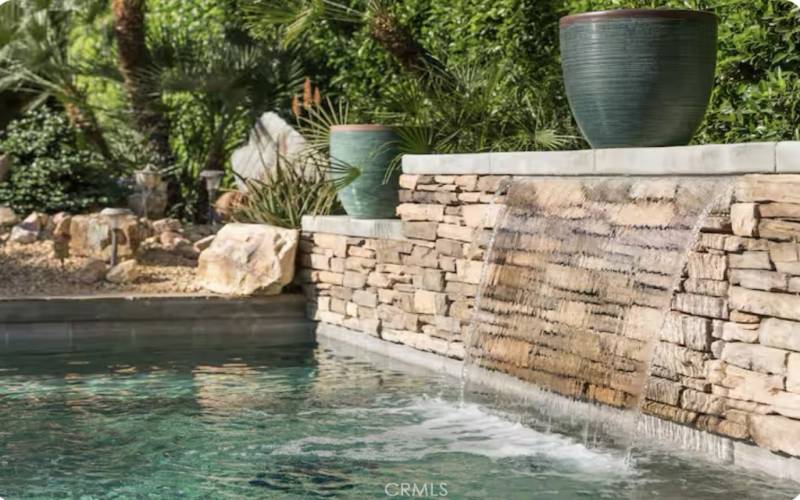 Waterfall feature within the pool.