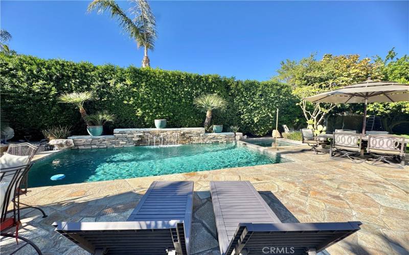 Pool and spa with ample seating provided.