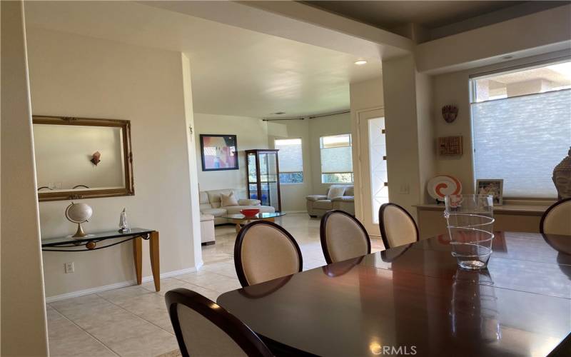 Formal dining room flows nicely into the family room and kitchen.