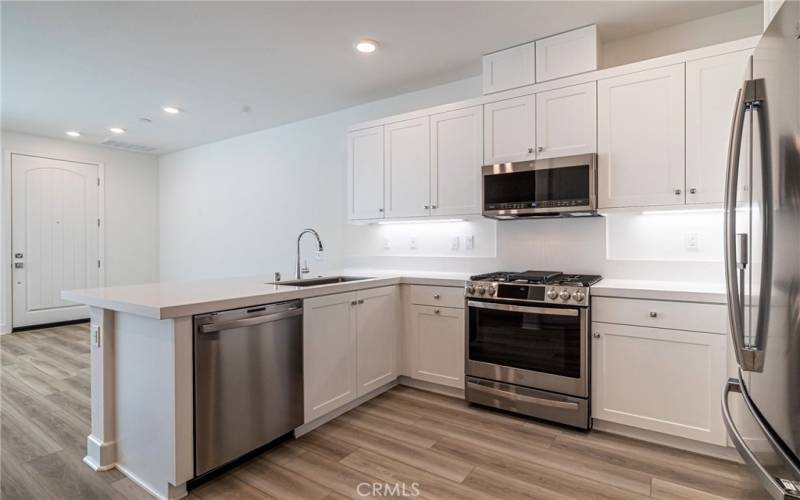 Beautiful white kitchen with stainless steal appliances