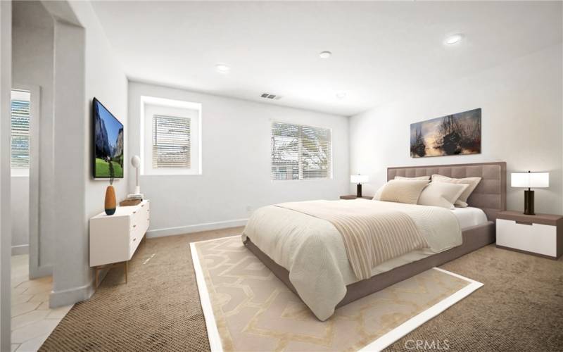 Staged spacious master bedroom with walk-in closet