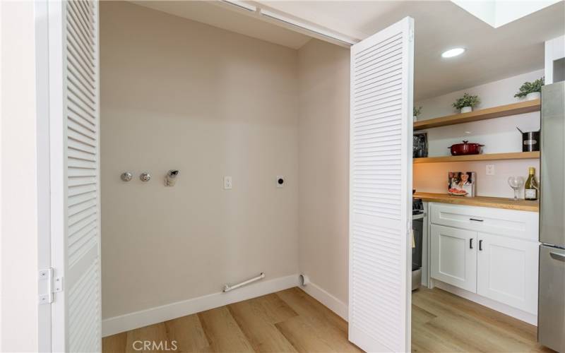 Washer/Dryer closet with hookups in the kitchen