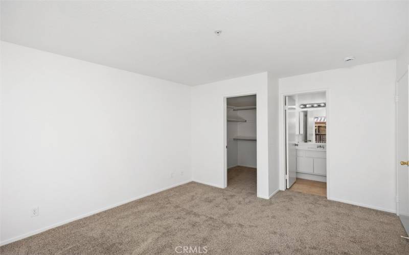 Walk-In Closet & Ensuite Bathroom in Primary Bedroom