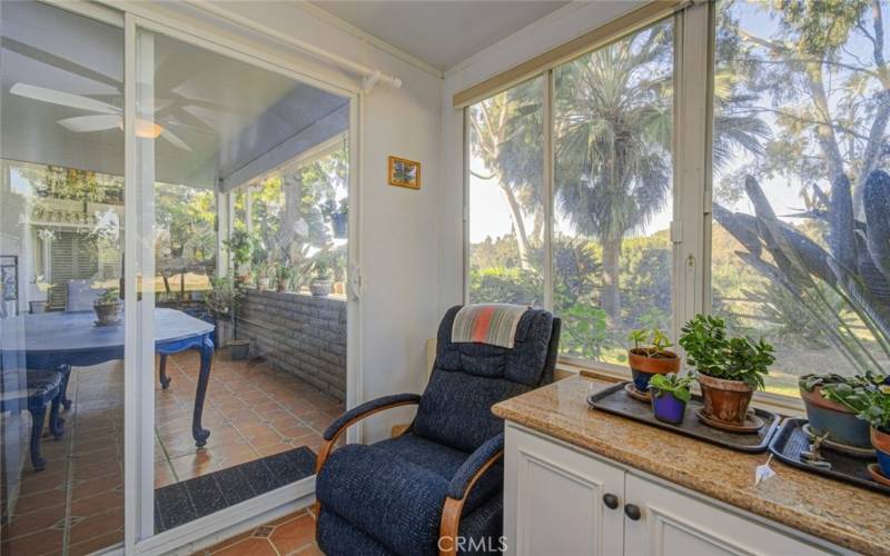 ENCLOSED PATIO WITH SLIDING DOOR TO THE OPEN PATIO