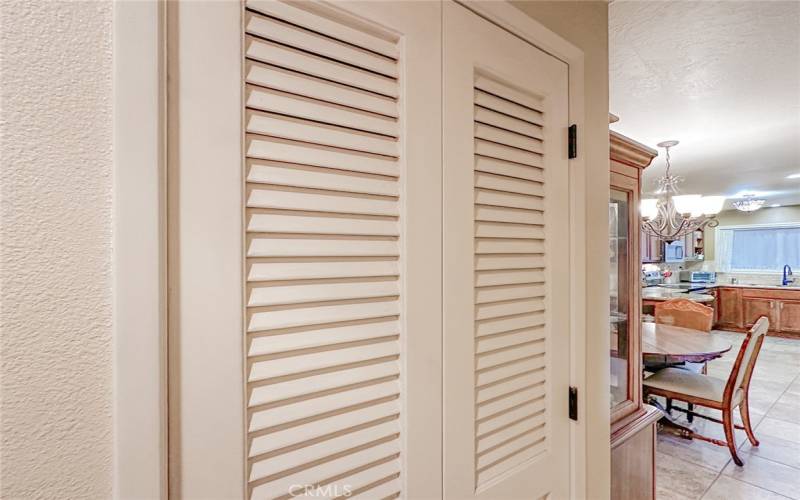 DOORS TO WASHER/DRYER ENCLOSURE IN THE HALLWAY