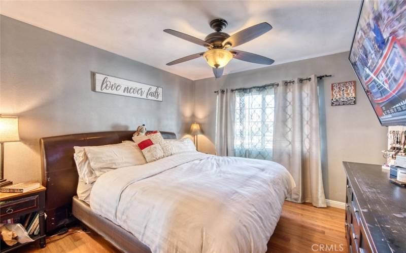 Primary bedroom with ceiling fan.