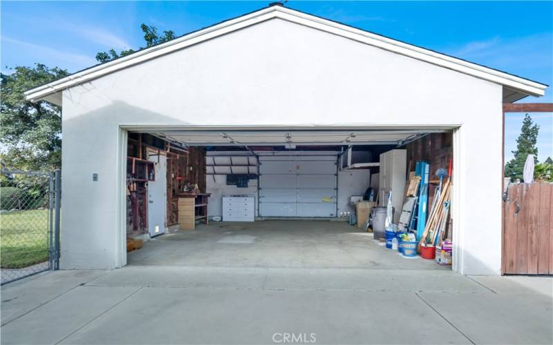 Drive-through 2 car garage. 2 sectional overhead front and rear garage doors. 1 side entry door to garage