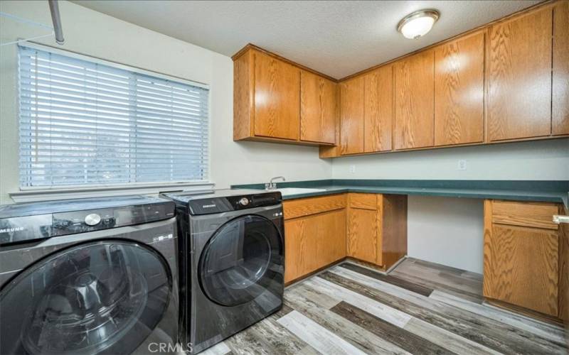 Laundry Room with loads of storage and a laundry chute from !st floor!